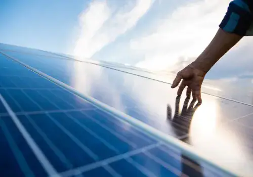 hands on solar panel that generates energy picture id1294628422.jpg