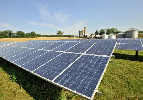 modern solar panel array in sunfilled green farm pasture picture id507544457.jpg