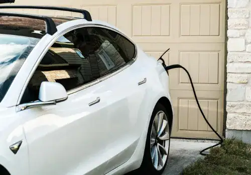 white tesla model 3 charging at home picture id1296606935.jpg