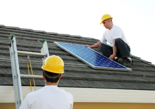 workmen installing a solar panel picture id157428249.jpg